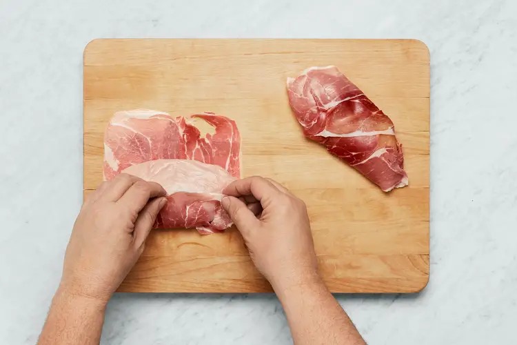 Wrapping chicken cutlets in prosciutto